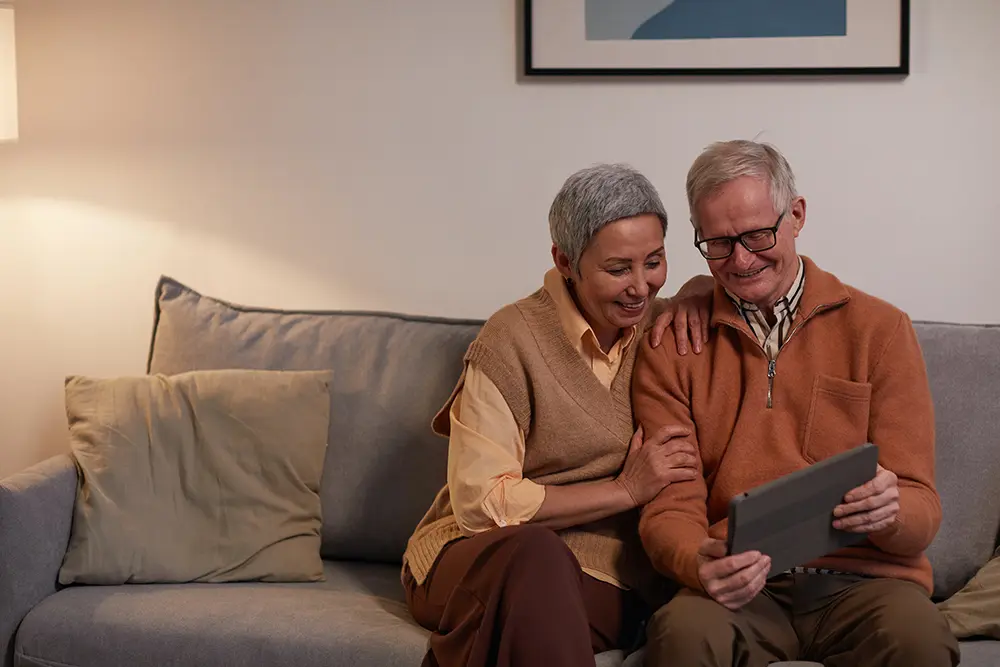 older couple sitting on a sofa